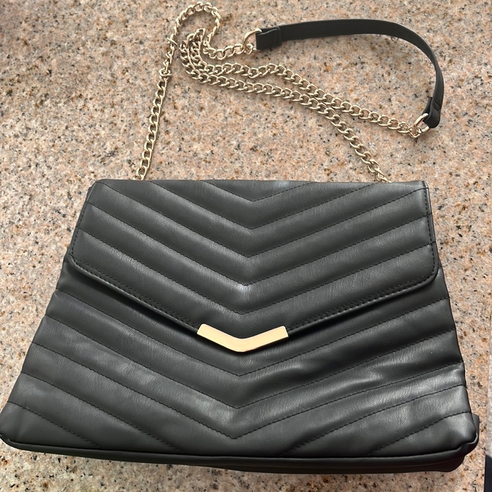 Black purse with gold chain